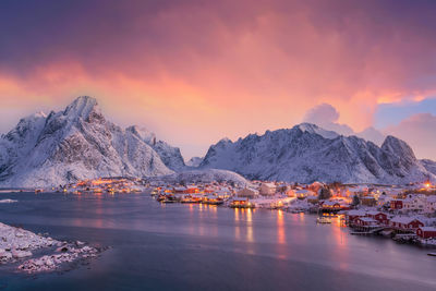 Scenic view of snowcapped mountains against sky during sunset