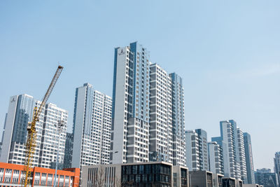 Low angle view of buildings against clear sky