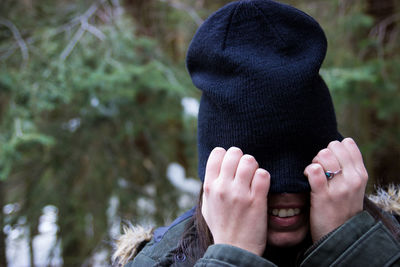 Close-up of young woman wearing knit hat