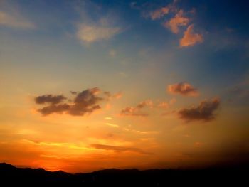 Low angle view of dramatic sky during sunset