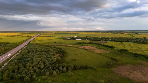Scenic view of agricultural field against sky