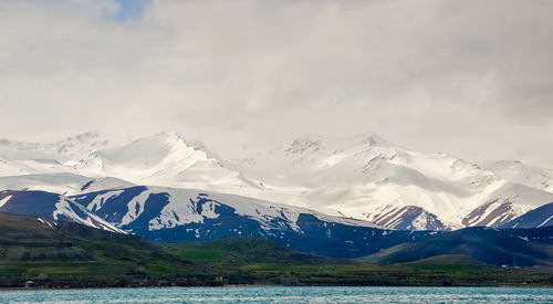 Scenic view of snowcapped mountains against sky