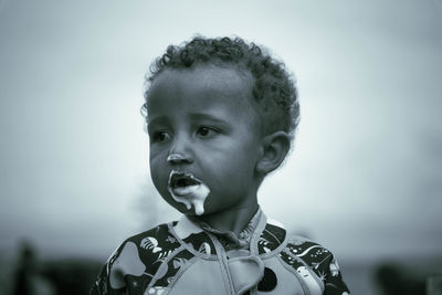 Portrait of cute boy looking away