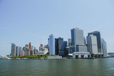 Modern buildings in city against clear sky