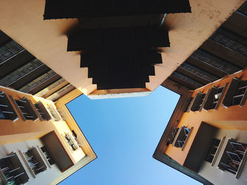 Low angle view of buildings against clear sky