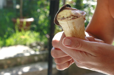 Close-up of hand holding ice cream