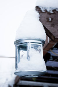 Close-up of snow covered car