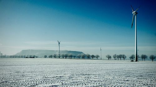 Scenic view of field against sky during winter