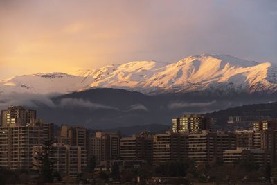 Snowcapped mountains against sky during sunset
