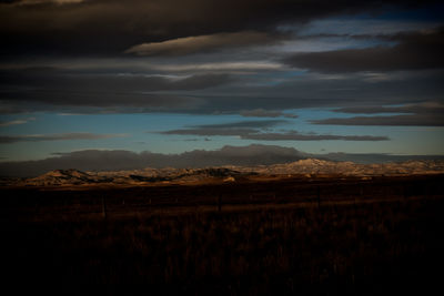 Scenic view of field against sky during sunset