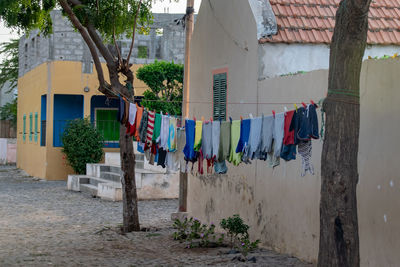 Clean clothes hanging on a washing line outside a residential buildilng