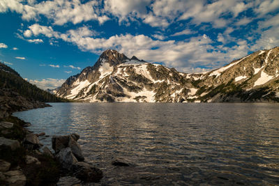 Scenic view of lake and mountains against sky