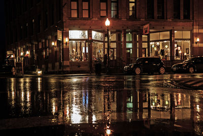 Reflection of illuminated buildings in city at night