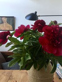 Close-up of flower vase on table at home