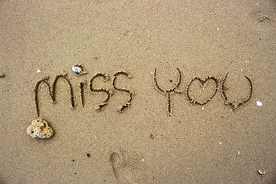 Text on sand at beach