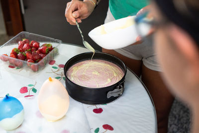 High angle view of woman preparing food on table