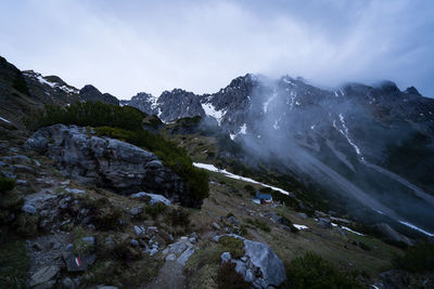 Scenic view of snowcapped mountains against sky