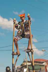 Low angle view of sculpture against sky