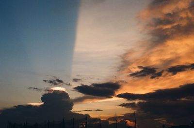 Low angle view of silhouette buildings against sky during sunset