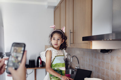 Girl preparing food in kitchen