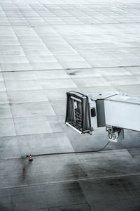 High angle view of passenger boarding bridge at airport