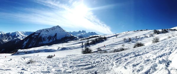 Scenic view of snowcapped mountains against sky