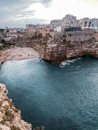 High angle view of townscape by sea