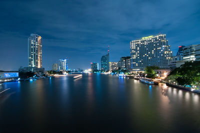 Illuminated buildings in city at night