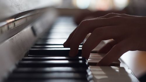 Cropped image of pianist playing piano