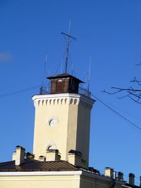 Low angle view of building against clear blue sky