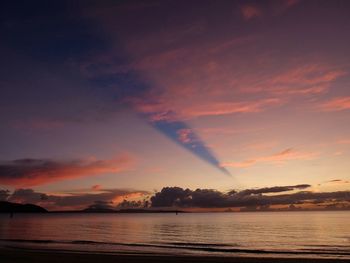 Scenic view of lake against sky at sunset