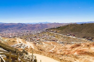 High angle view of landscape against clear blue sky