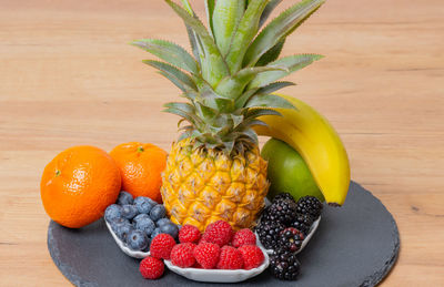 Close-up of pineapple in plate on table