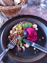 High angle view of vegetables in basket on table