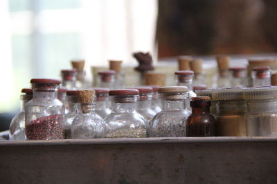 Close-up of wine bottles in shelf