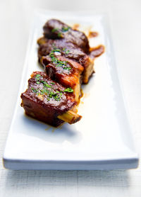 Close-up of roasted meat in plate