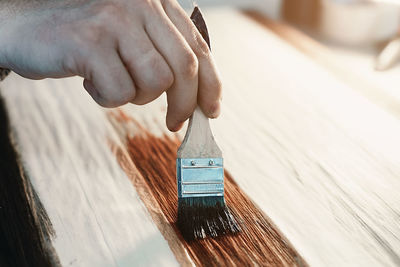 Midsection of person working on wood