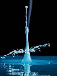 Close-up of water over black background