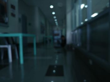 Man walking in illuminated corridor