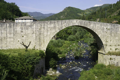 Arch bridge over mountain