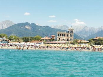 Sea with buildings in background