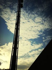 Low angle view of building against cloudy sky