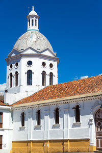Exterior of san sebastian church against clear blue sky in city