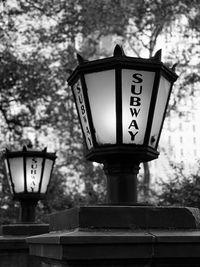 Low angle view of clock on street light