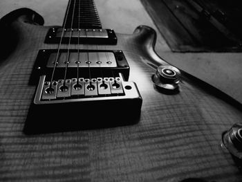 High angle view of guitar on table