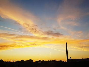 Low angle view of silhouette landscape against sky during sunset