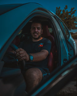 Man sitting in car