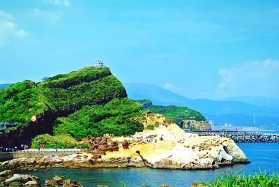 Scenic view of sea against blue sky