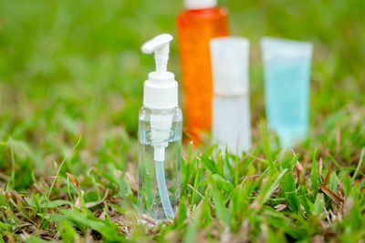 Close-up of bottle on field