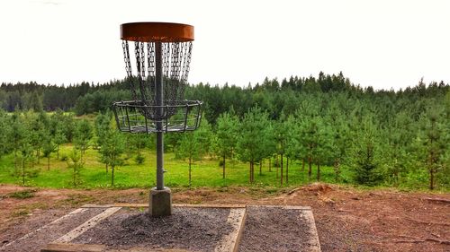 Built structure on field against sky